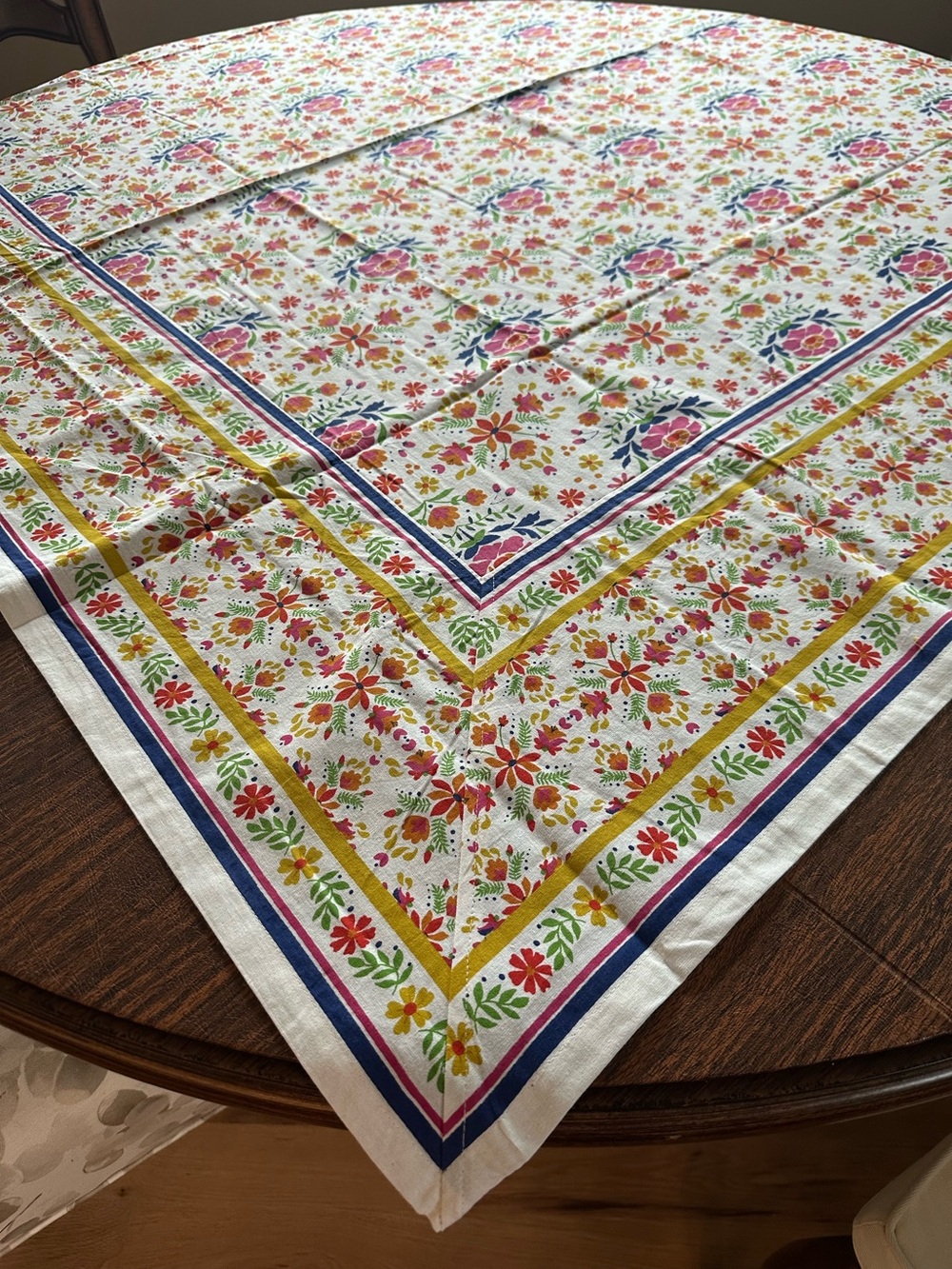 100% cotton,Floral Tablecloth 60x60 square with colorful accents.